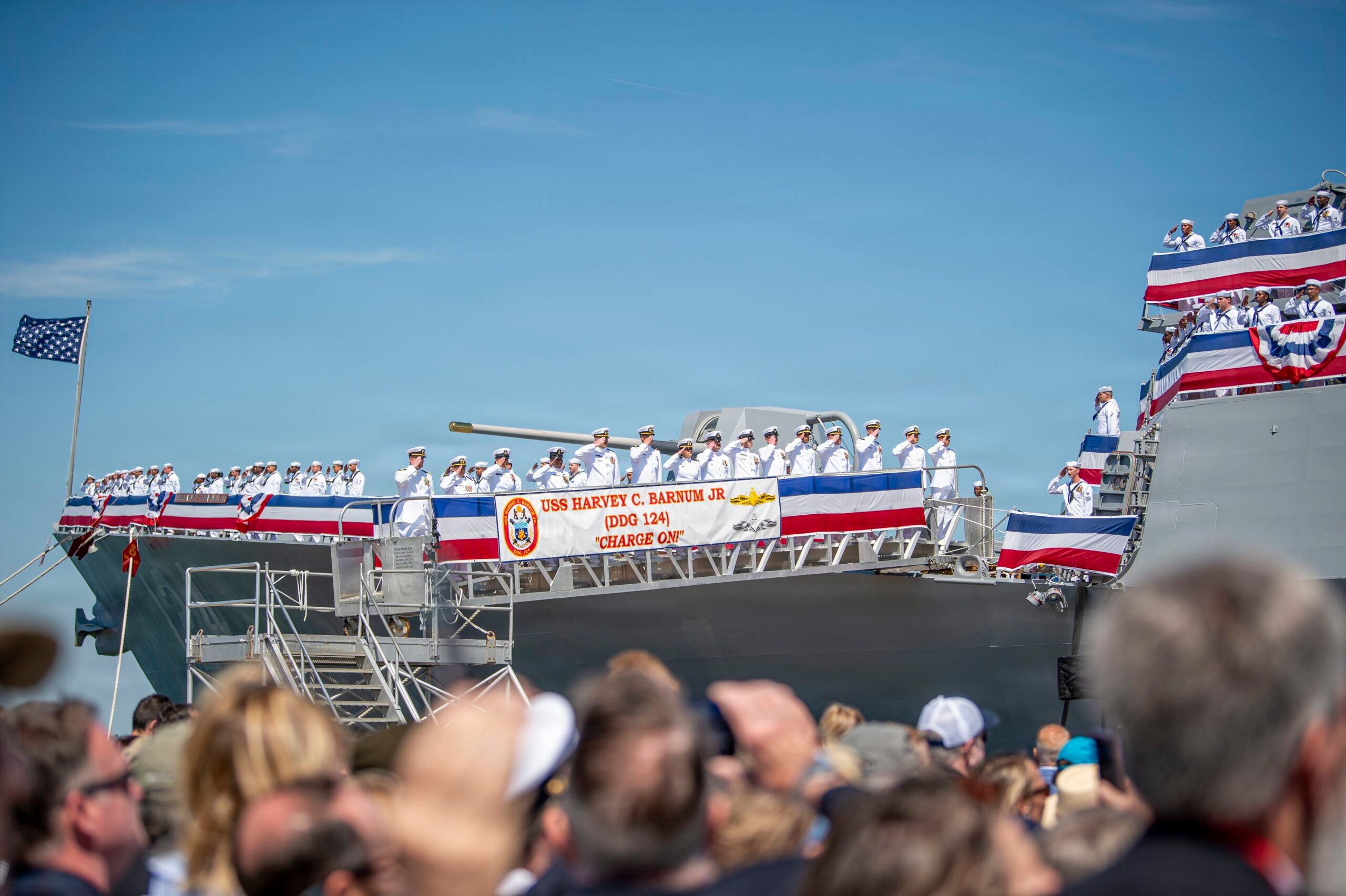 NORFOLK, Va. (April 11, 2026) – Sailors assigned to the Navy’s newest Arleigh Burke-class guided-missile destroyer USS Harvey C. Barnum Jr. (DDG 124) man the rails during the commissioning ceremony of the warship in Norfolk, Virginia, April 11, 2026. The warship bears the name of a living Medal of Honor recipient, retired Col. Harvey C. “Barney” Barnum Jr. (U.S. Navy photo by Mass Communication Specialist Seaman Oliver McCain Vieira)