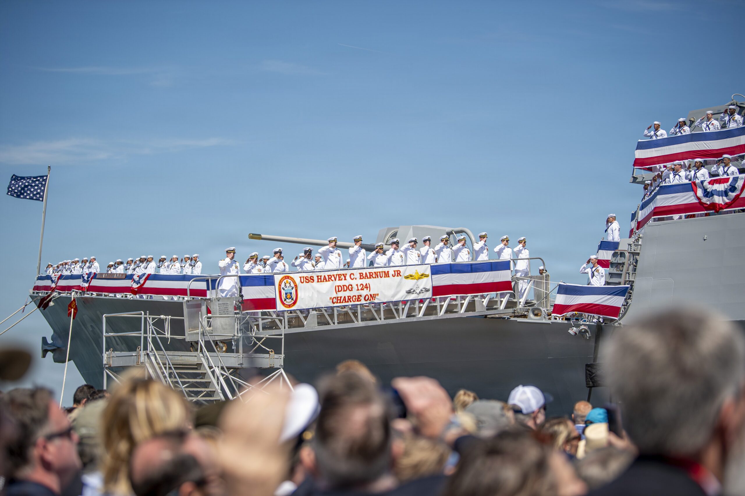 NORFOLK, Va. (April 11, 2026) – Sailors assigned to the Navy’s newest Arleigh Burke-class guided-missile destroyer USS Harvey C. Barnum Jr. (DDG 124) man the rails during the commissioning ceremony of the warship in Norfolk, Virginia, April 11, 2026. The warship bears the name of a living Medal of Honor recipient, retired Col. Harvey C. “Barney” Barnum Jr. (U.S. Navy photo by Mass Communication Specialist Seaman Oliver McCain Vieira)